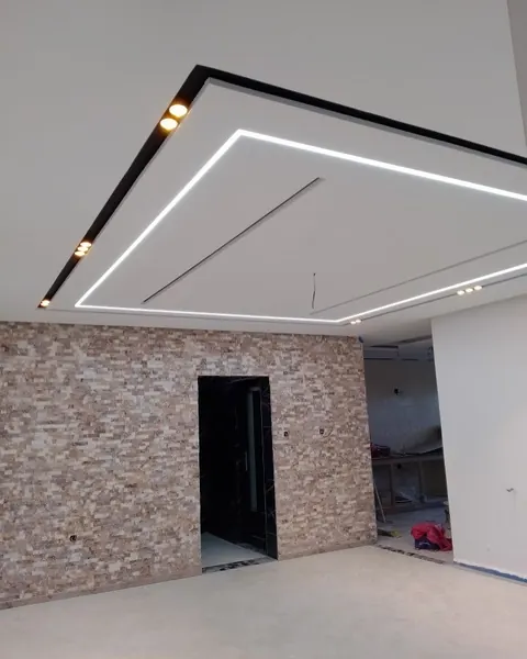 Finished gypsum ceiling with recessed linear lighting