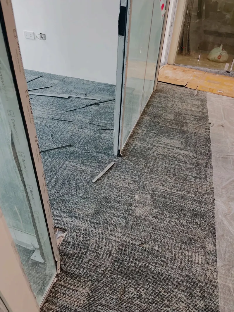 Office carpet tiles being fitted