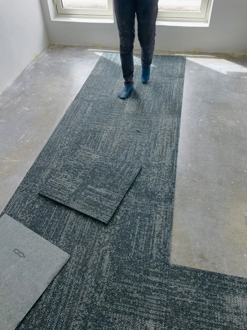 Office carpet tiles being fitted