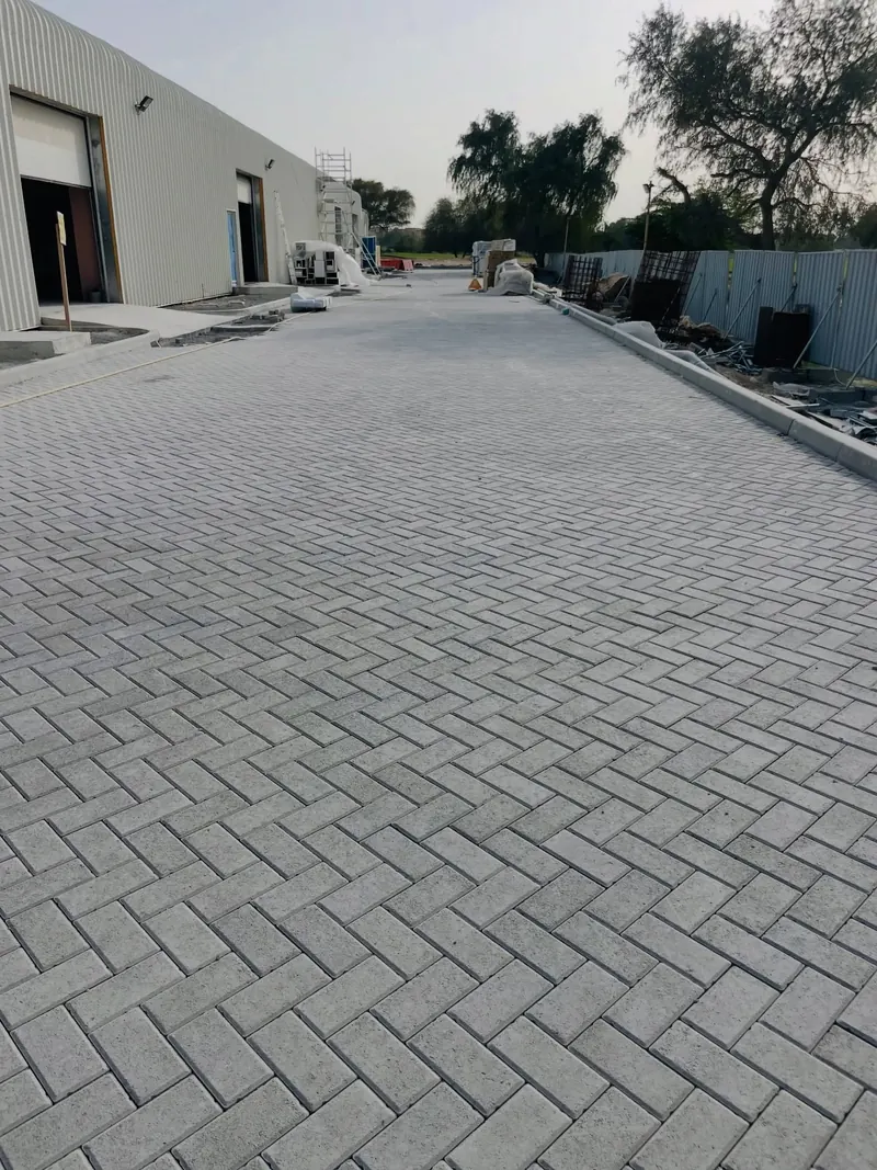 Grey interlock paving, warehouse yard