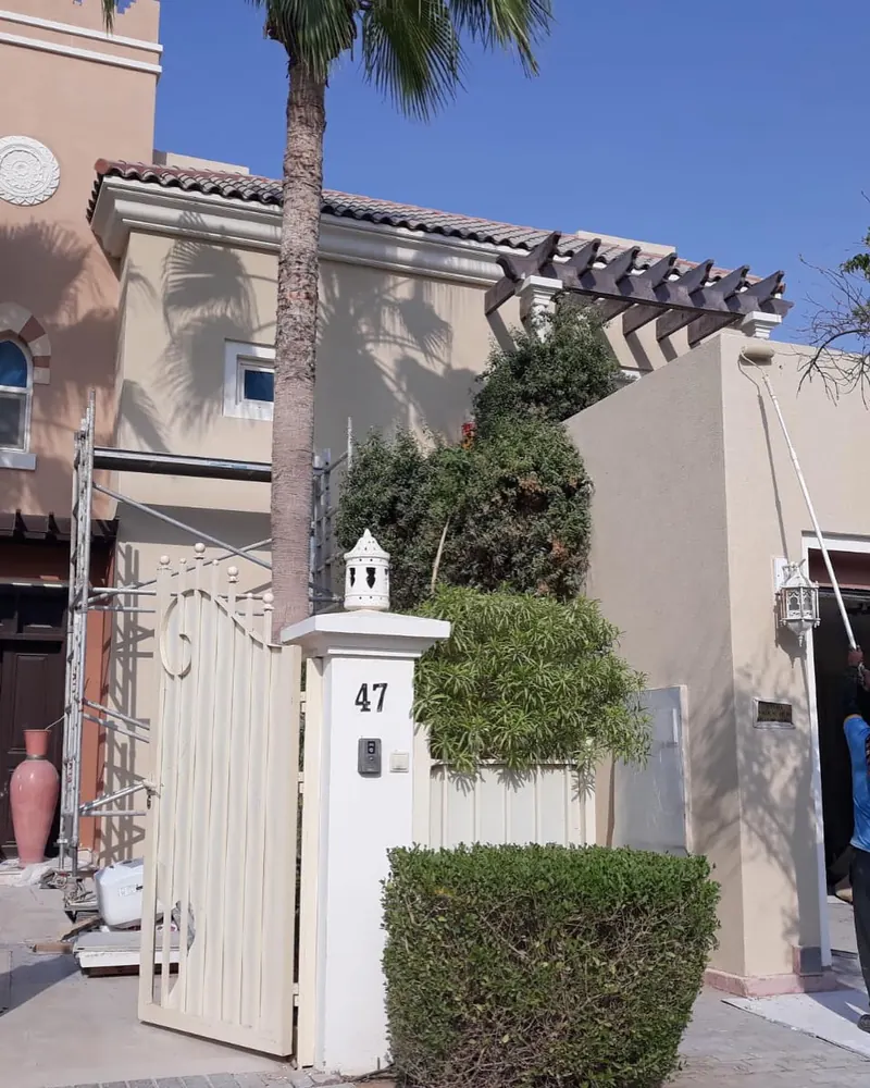 Villa exterior painting — Dubai Sports City — detail