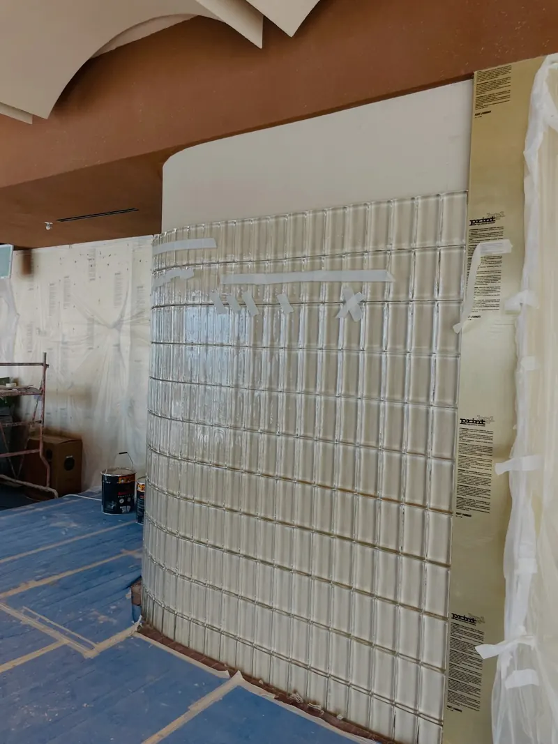Curved glass block wall under construction