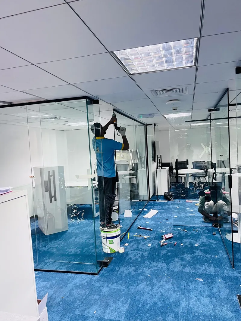 Glass partitions and carpet, office fit-out — detail