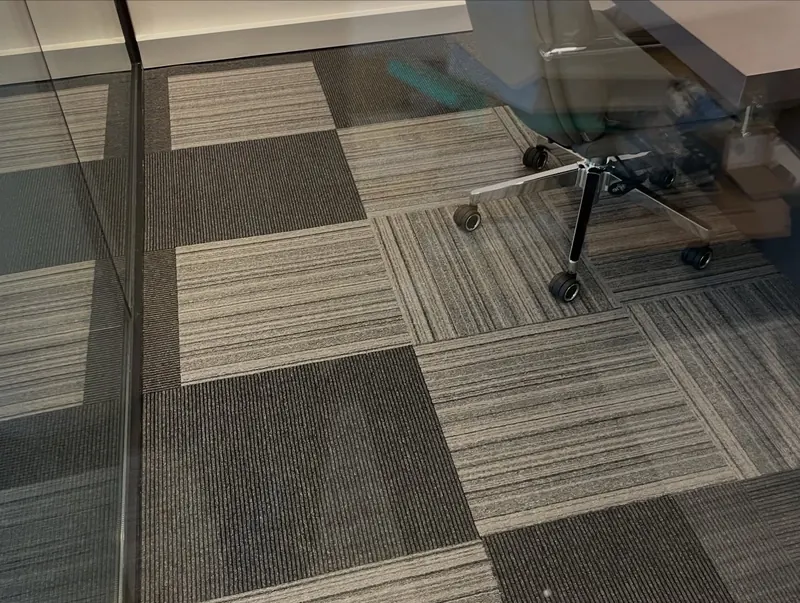 Office fit-out with glass partitions and carpet tiles