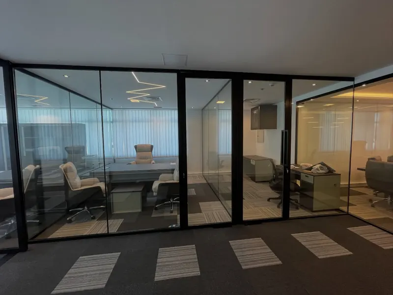 Office fit-out, glass partitions and carpet tiles — detail